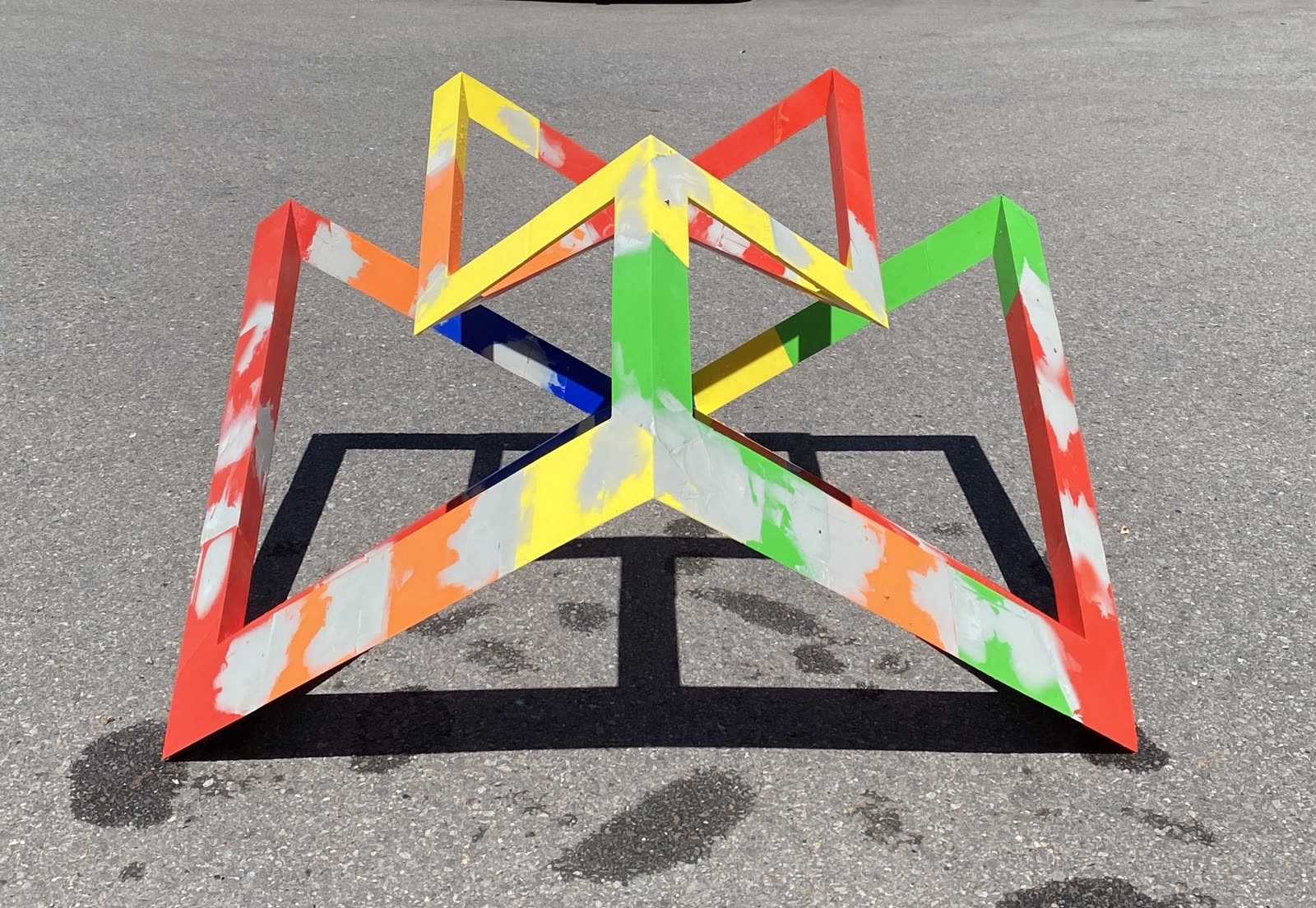 The Time Crystal: a hand-built geometric sculpture of interlocking triangular frames forming a closed lattice